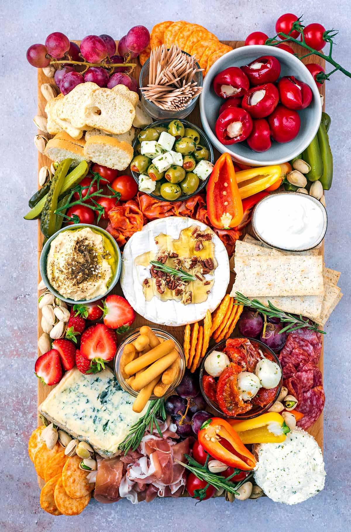 A sharing platter of meats, cheeses, breads and vegetables.