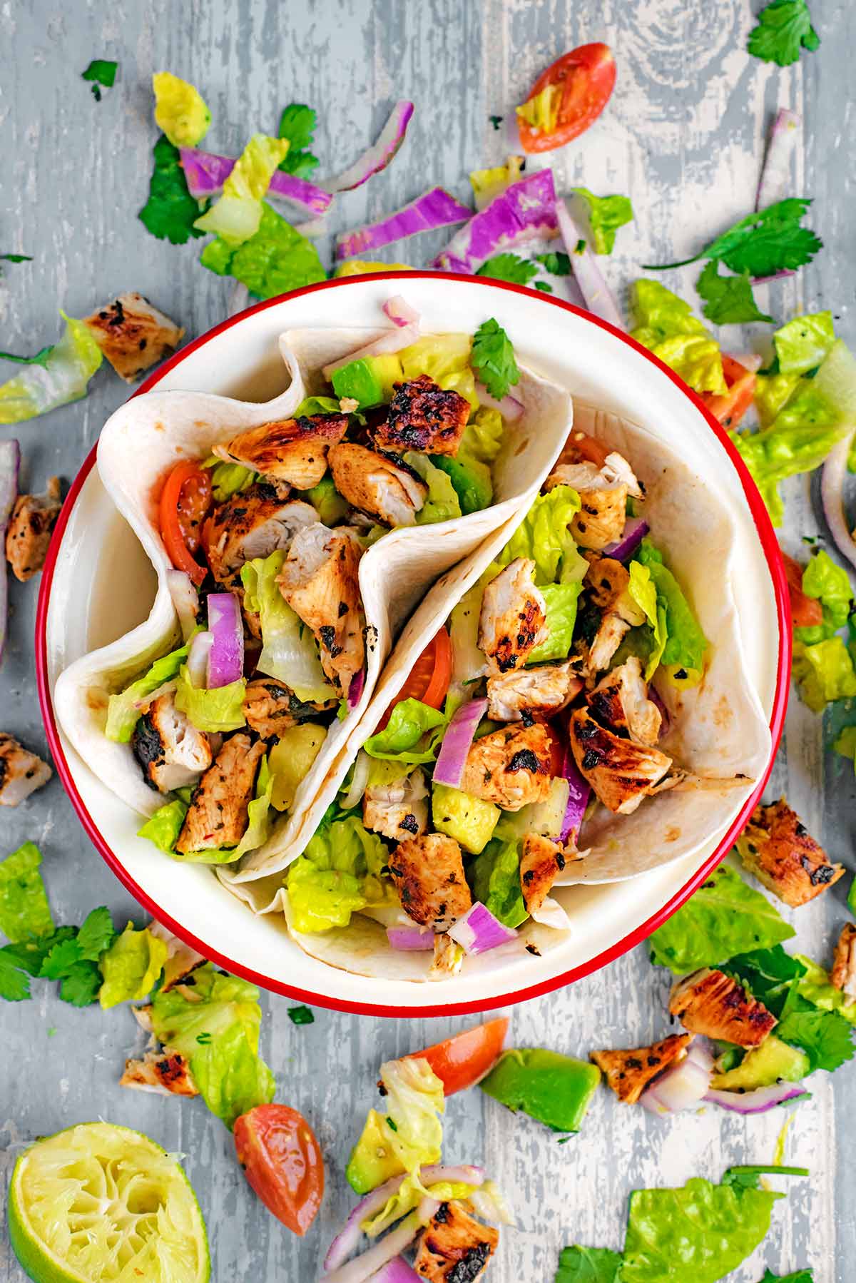 Chicken tacos in a round serving bowl.