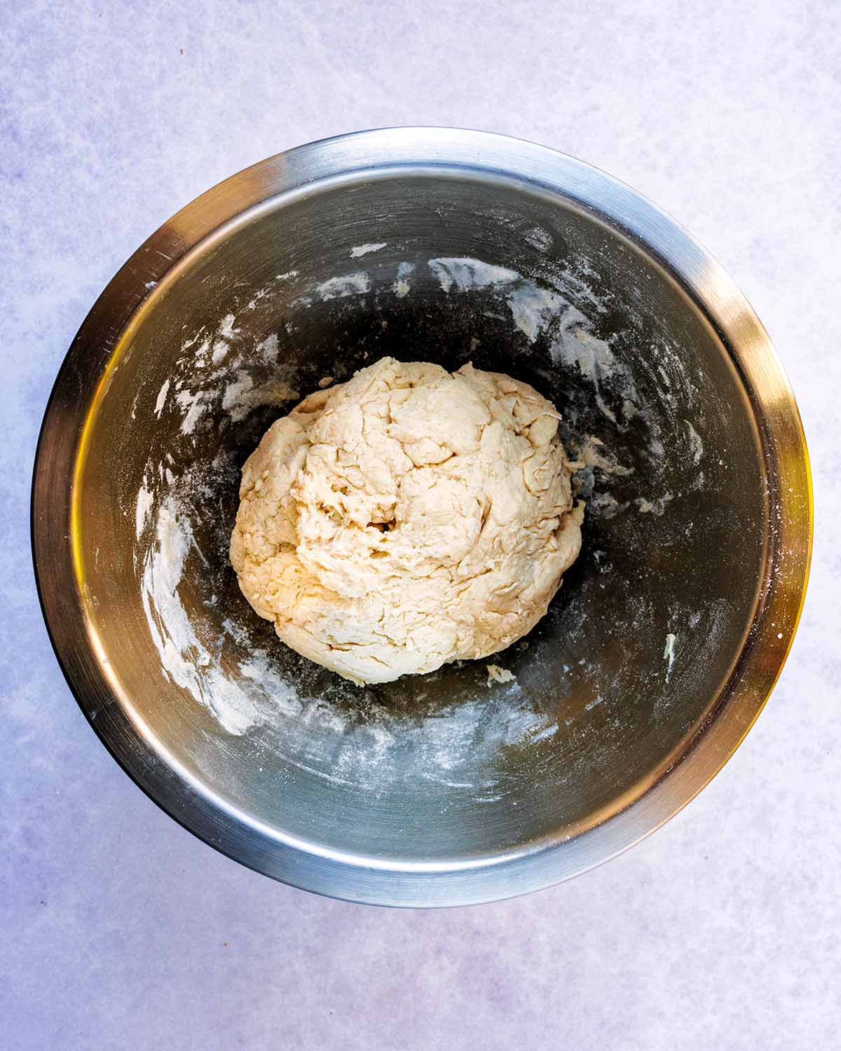 A ball of sough in the mixing bowl.