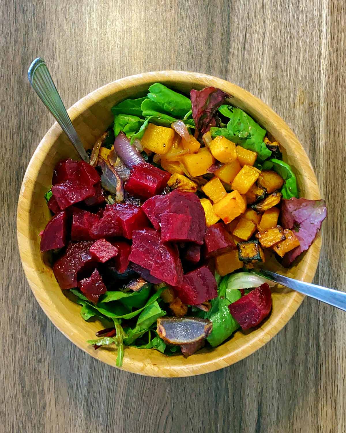 Cooked pumpkin and onion and beetroot added to the lettuce.