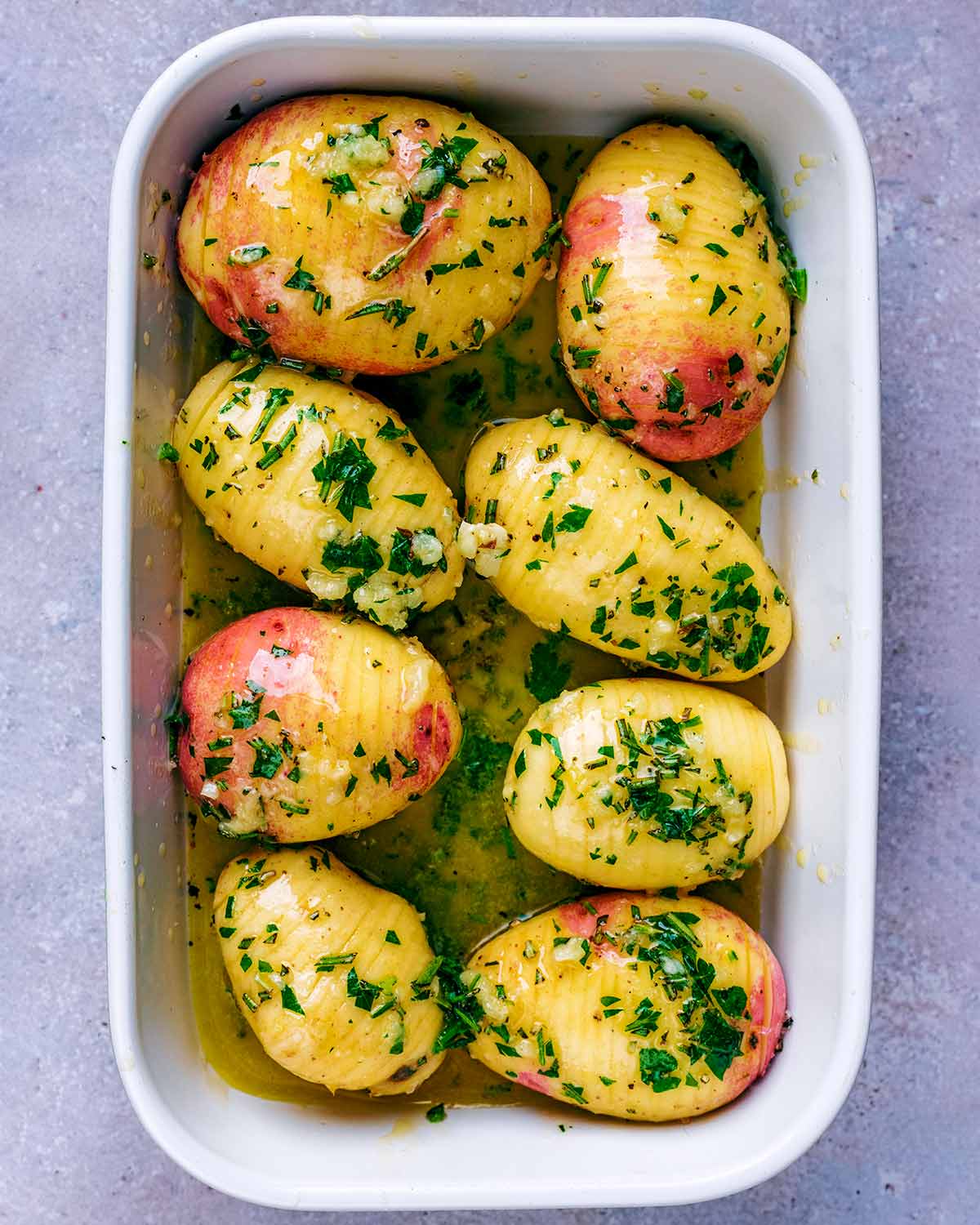 Melted butter and herbs poured over the pottaoes.
