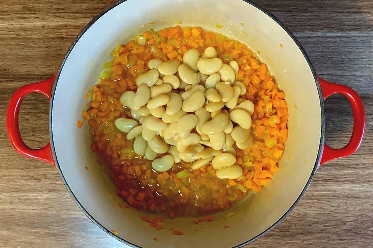 Butter beans added to the pan.