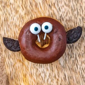 A Halloween Doughnut Bat on a wooden surface.