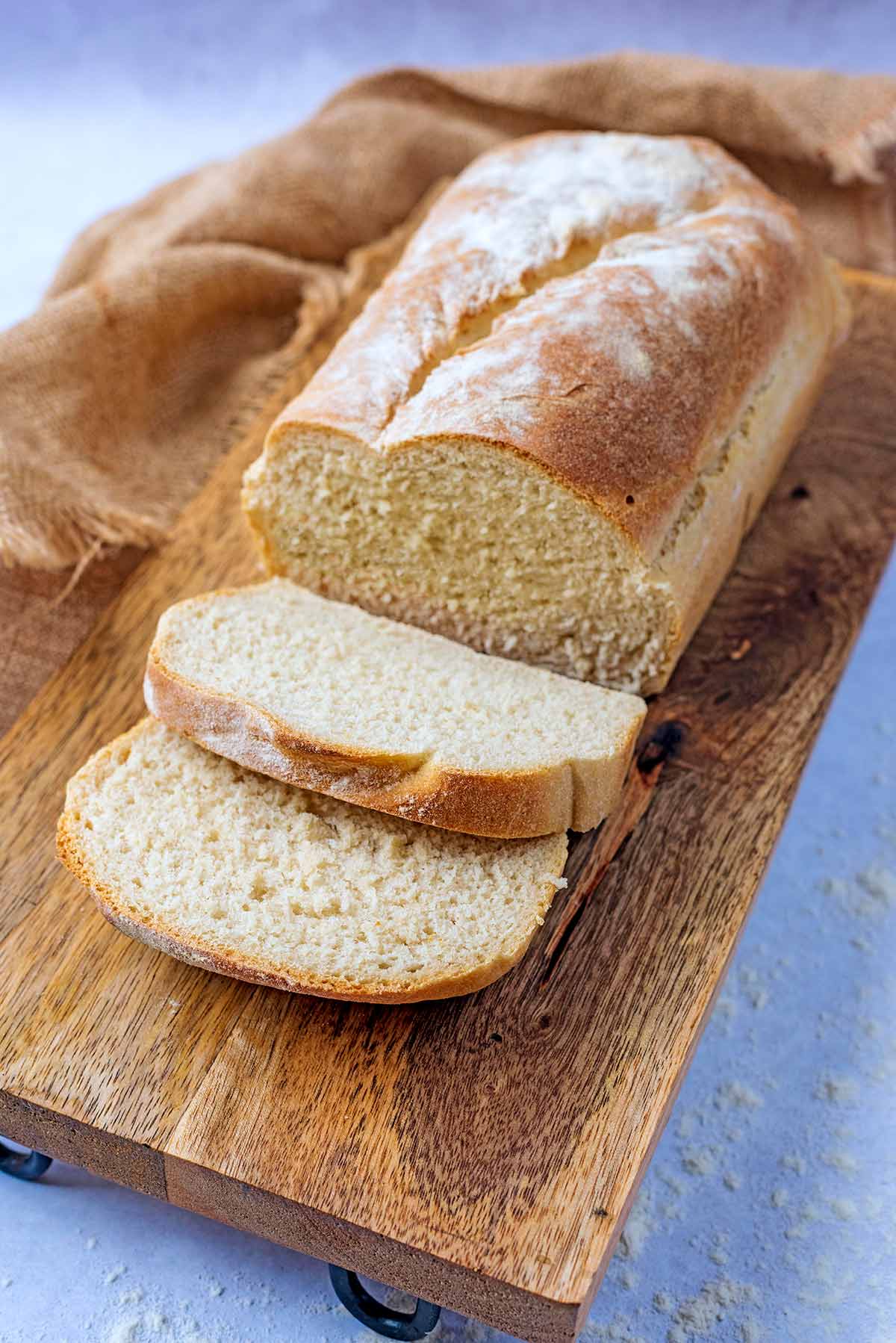 A loaf of bread with two slices cut off.