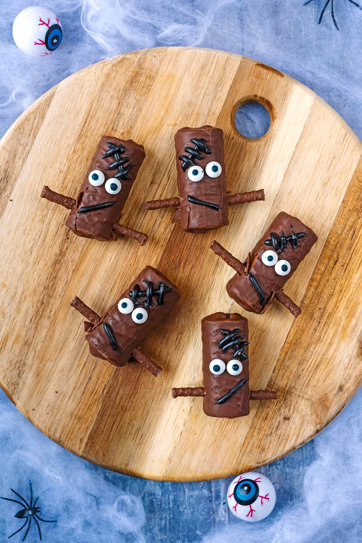Five chocolate mini rolls decorated like Frankenstein's monster.
