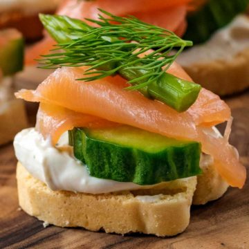 Smoked Salmon Canapes on a wooden board.