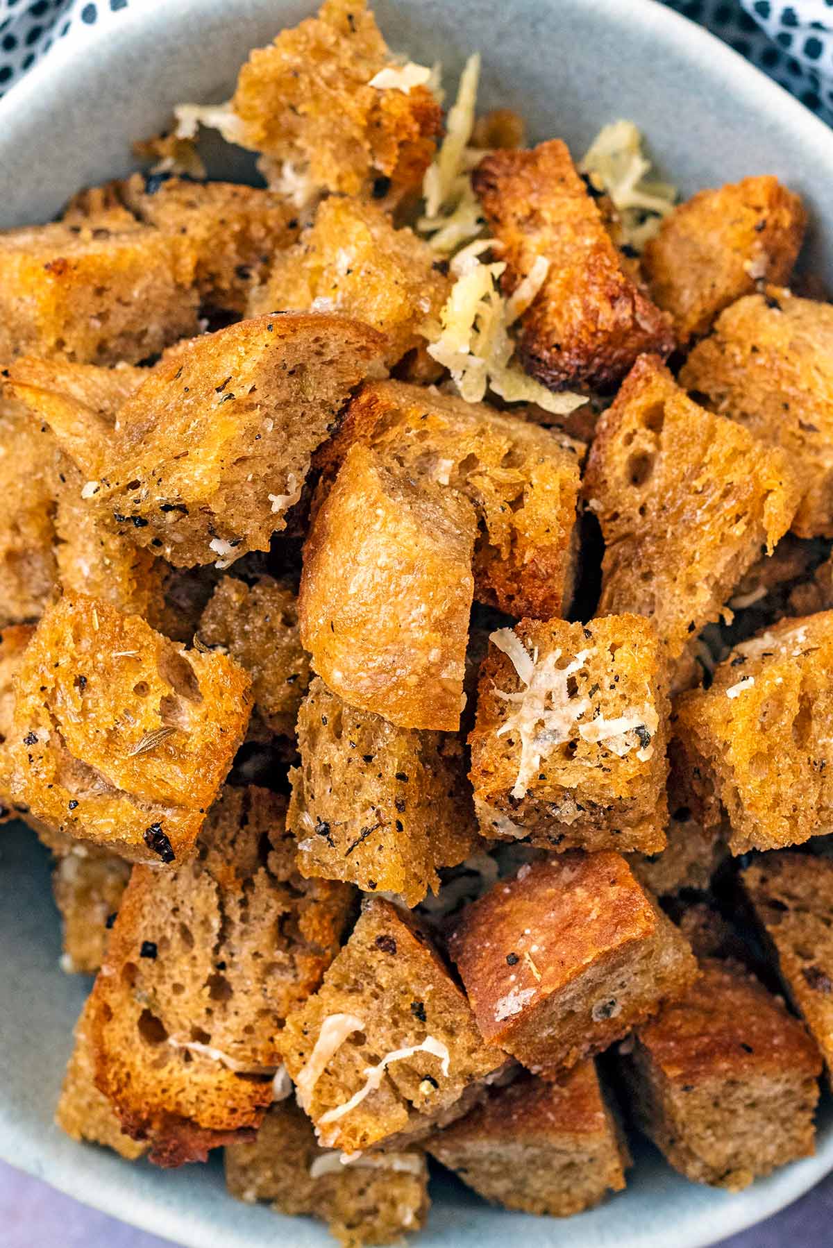 Croutons with grated Parmesan on them.