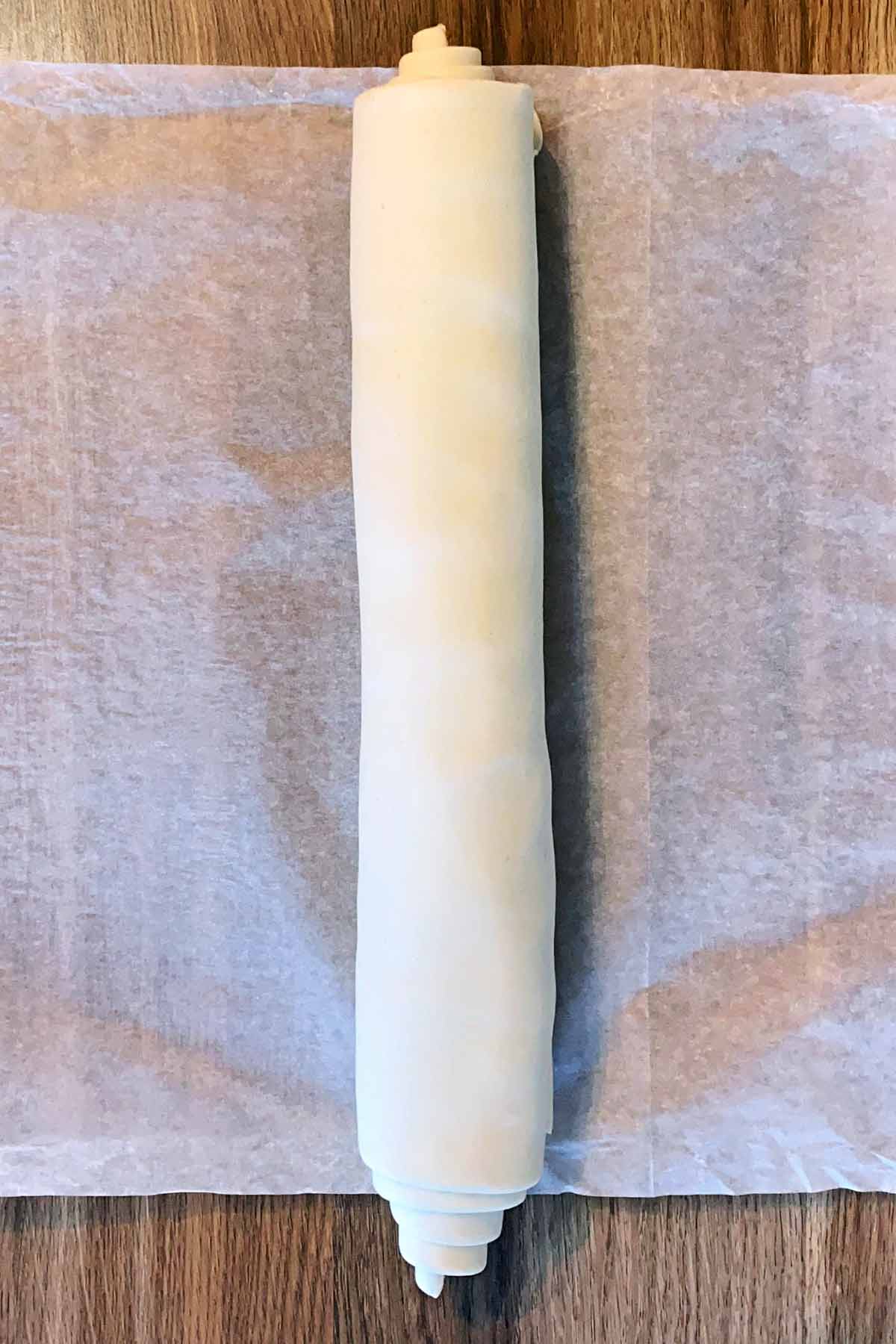 the puff pastry rolled up into a sausage shape.