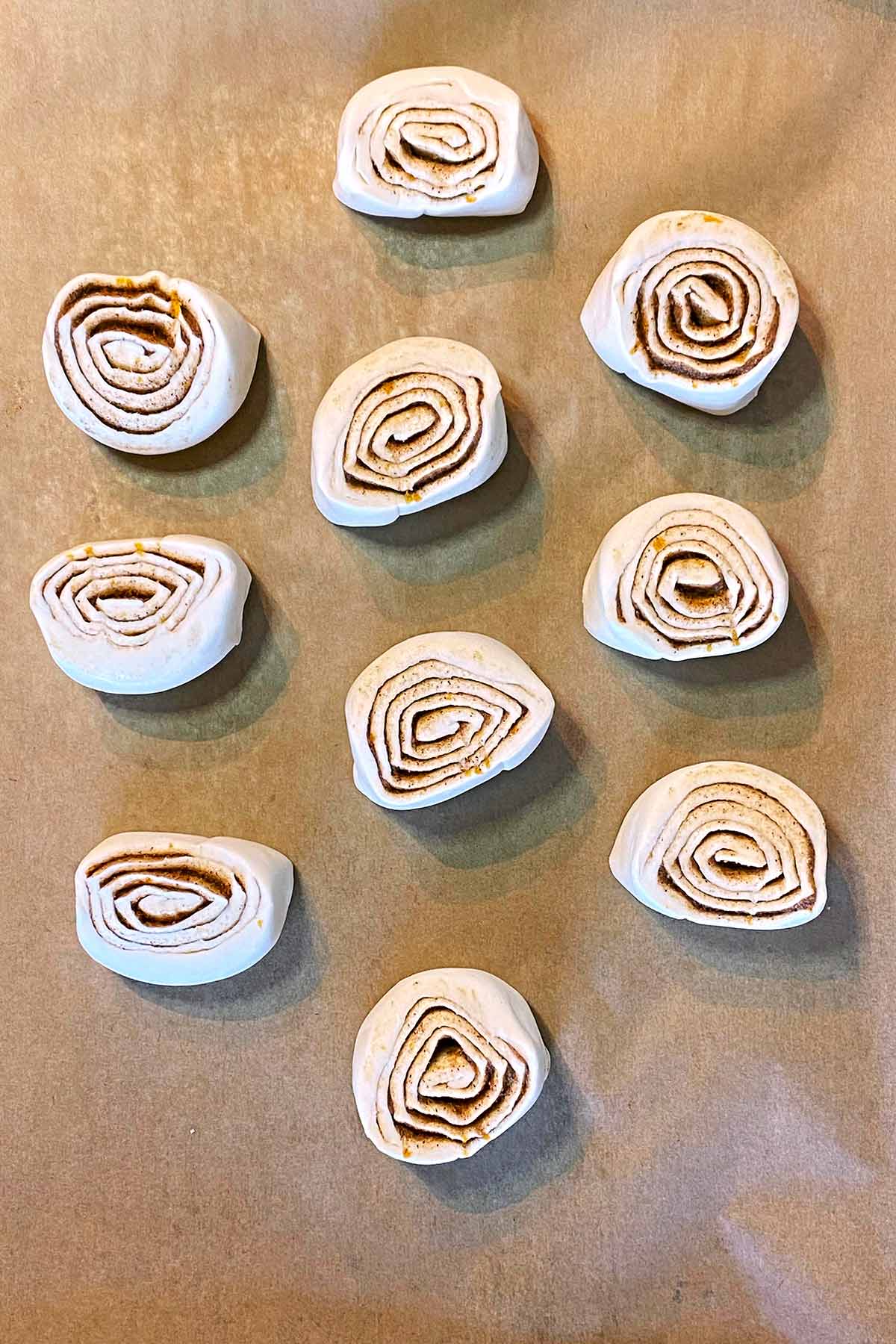 The pastry roll cut into 10 individual rolls.