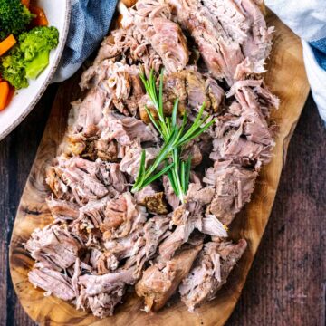 Slow Cooker Lamb Shoulder cut up and presented on a serving board.