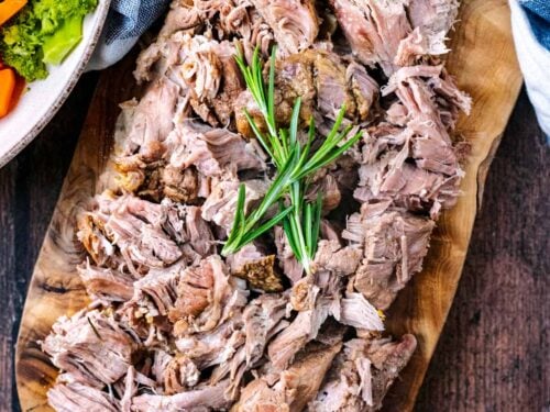 Slow Cooker Lamb Shoulder cut up and presented on a serving board.