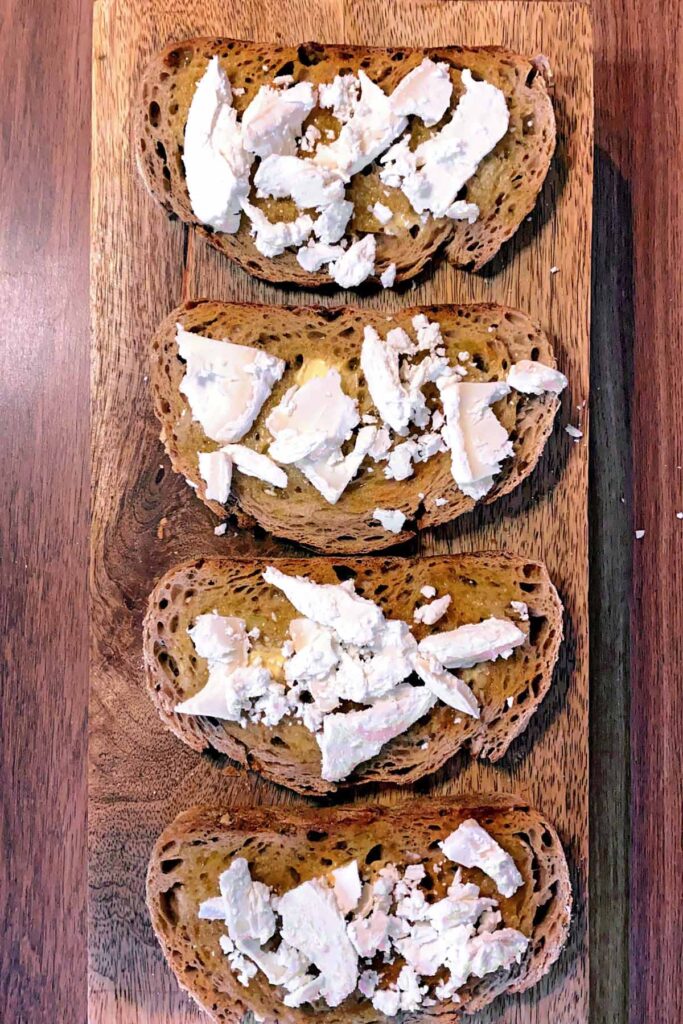 Goat's cheese added to the toast.