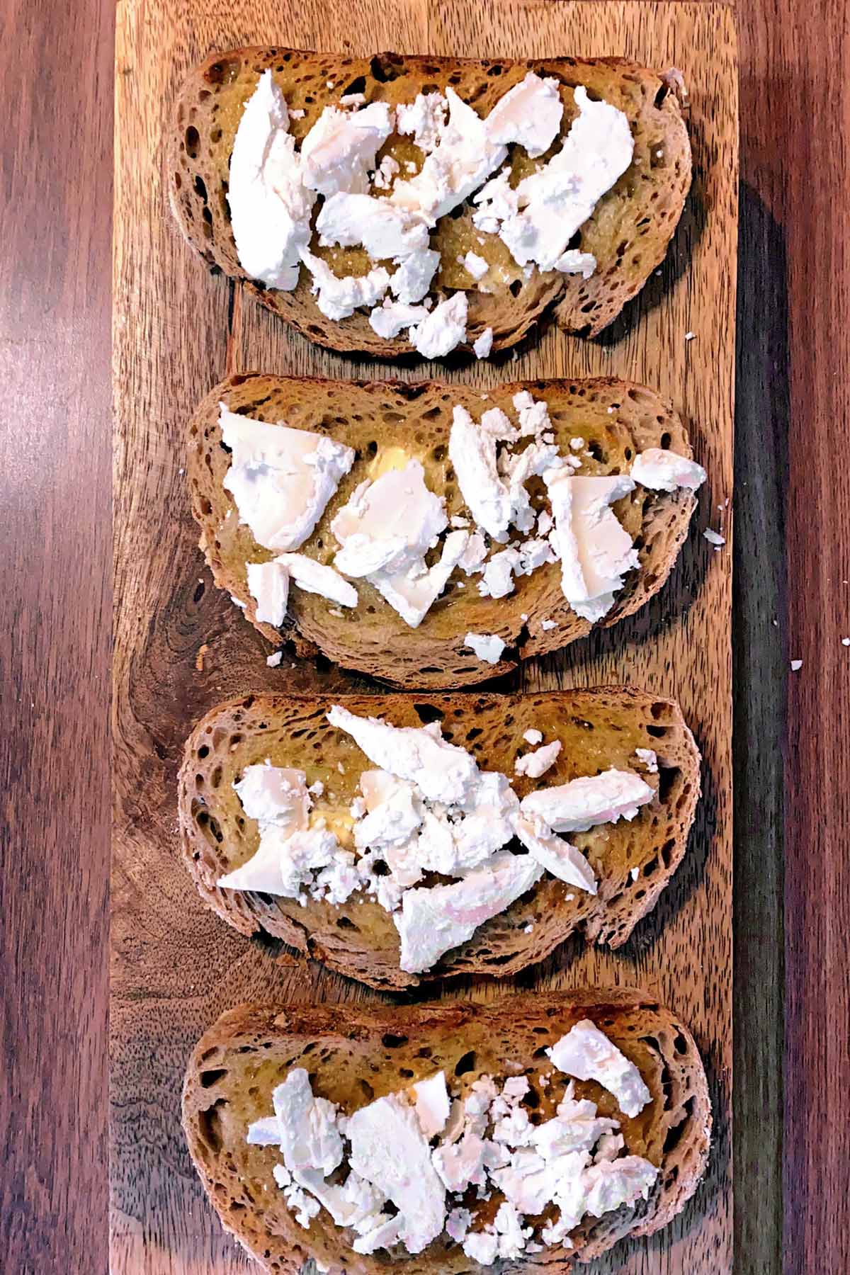 Goat's cheese added to the toast.