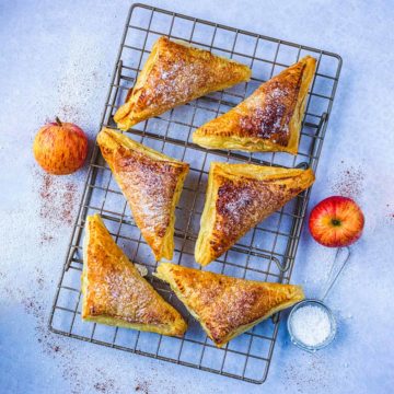 Apple turnovers on a cooling rack.