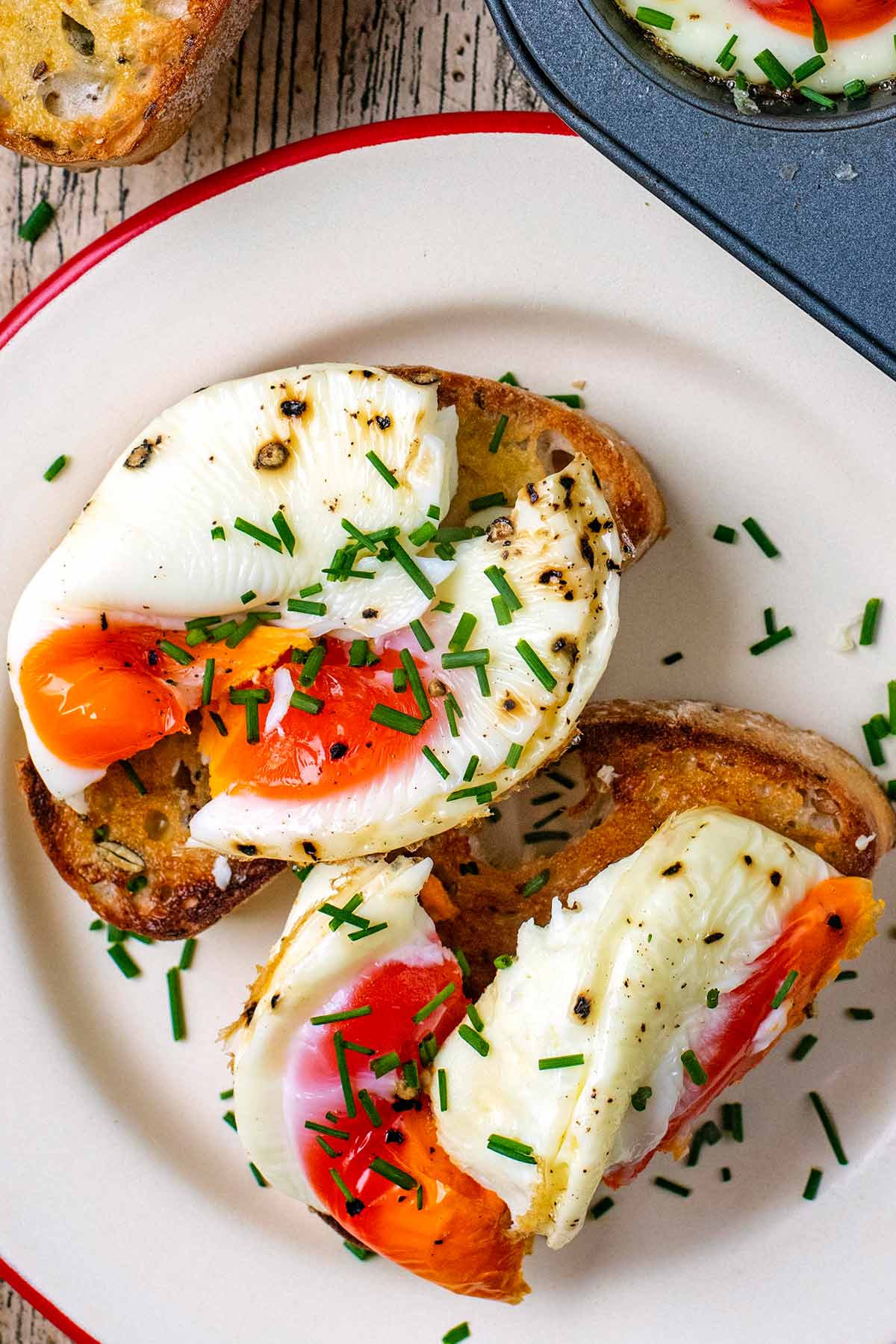 Eggs on toast topped with chopped chives.