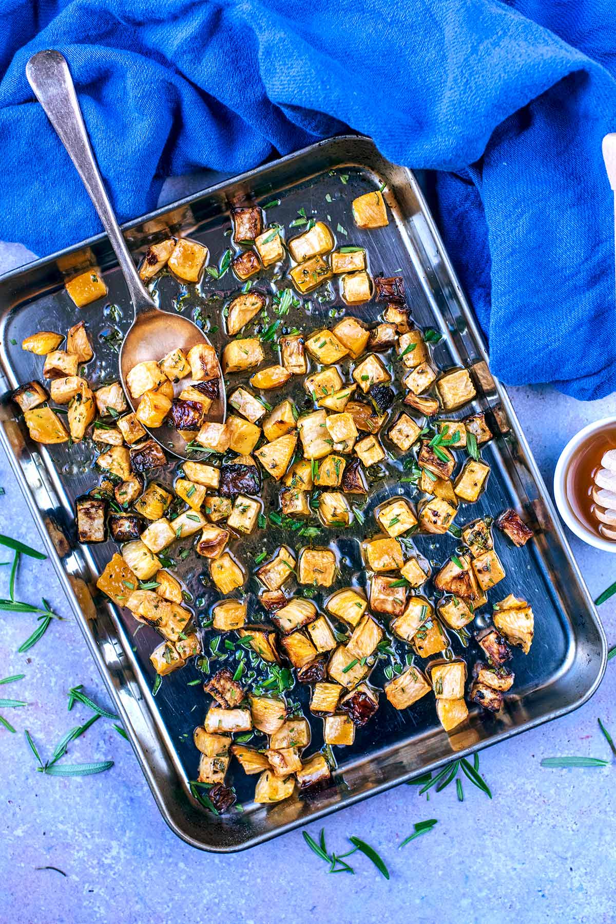 Small cubes of roast swede on a baking tray.