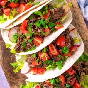 Beef Barbacoa in soft tacos.