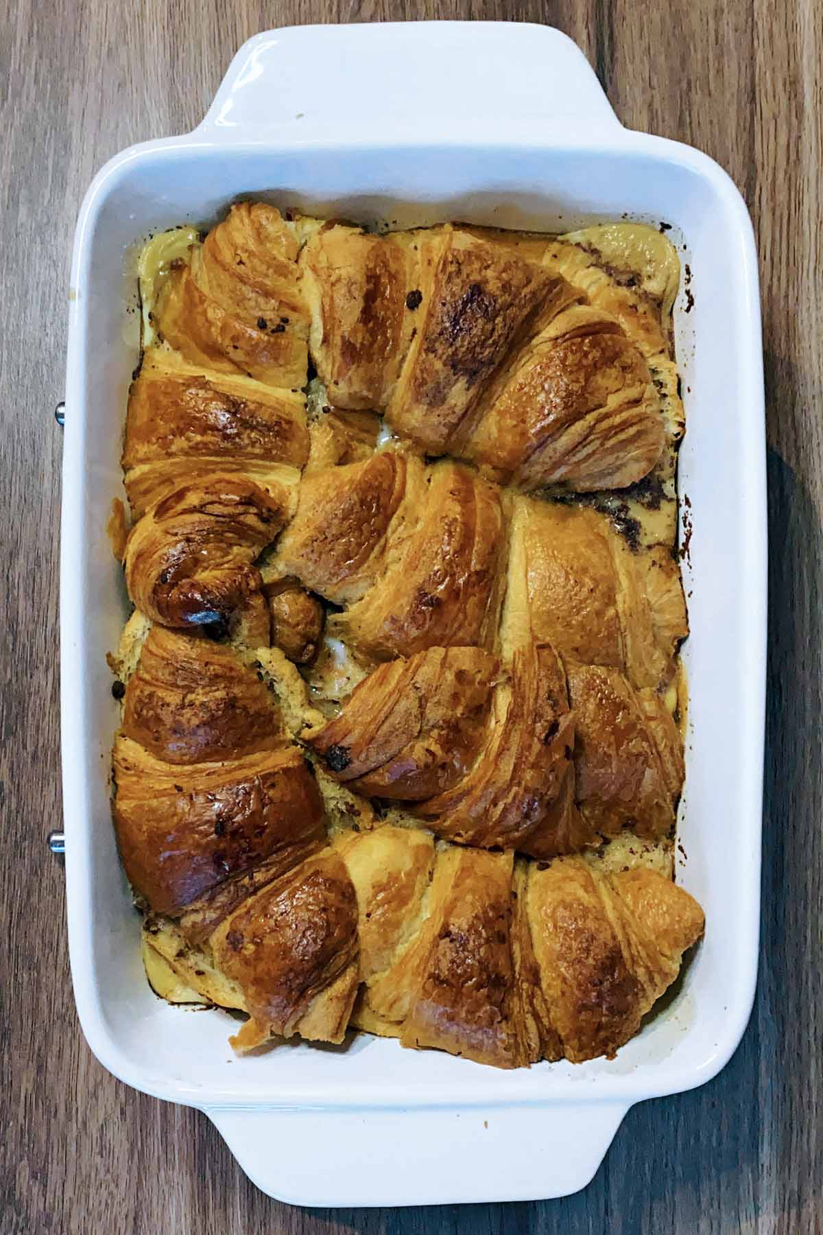 Baked croissants in a baking dish.