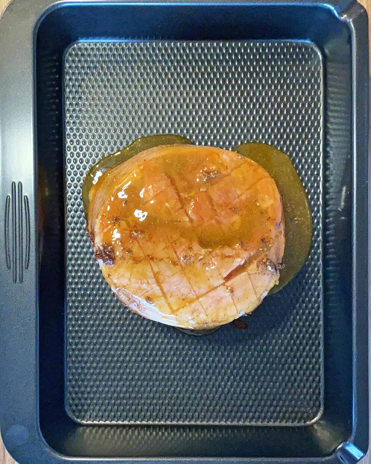 The honey mustard dressing poured over the gammon.