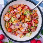 Cucumber and Radish Salad in a round serving bowl.