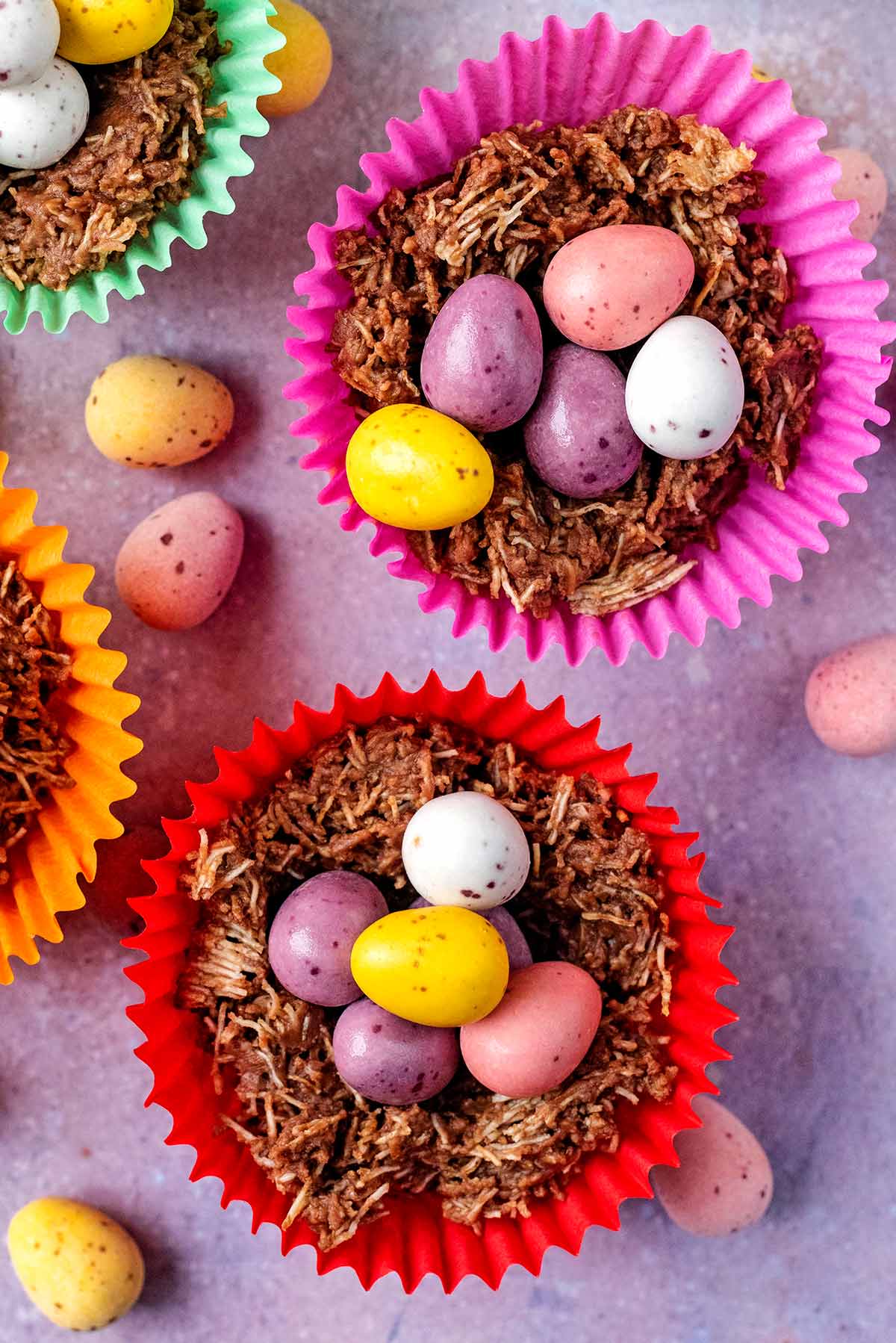 Two chocolate easter nests topped with mini eggs.