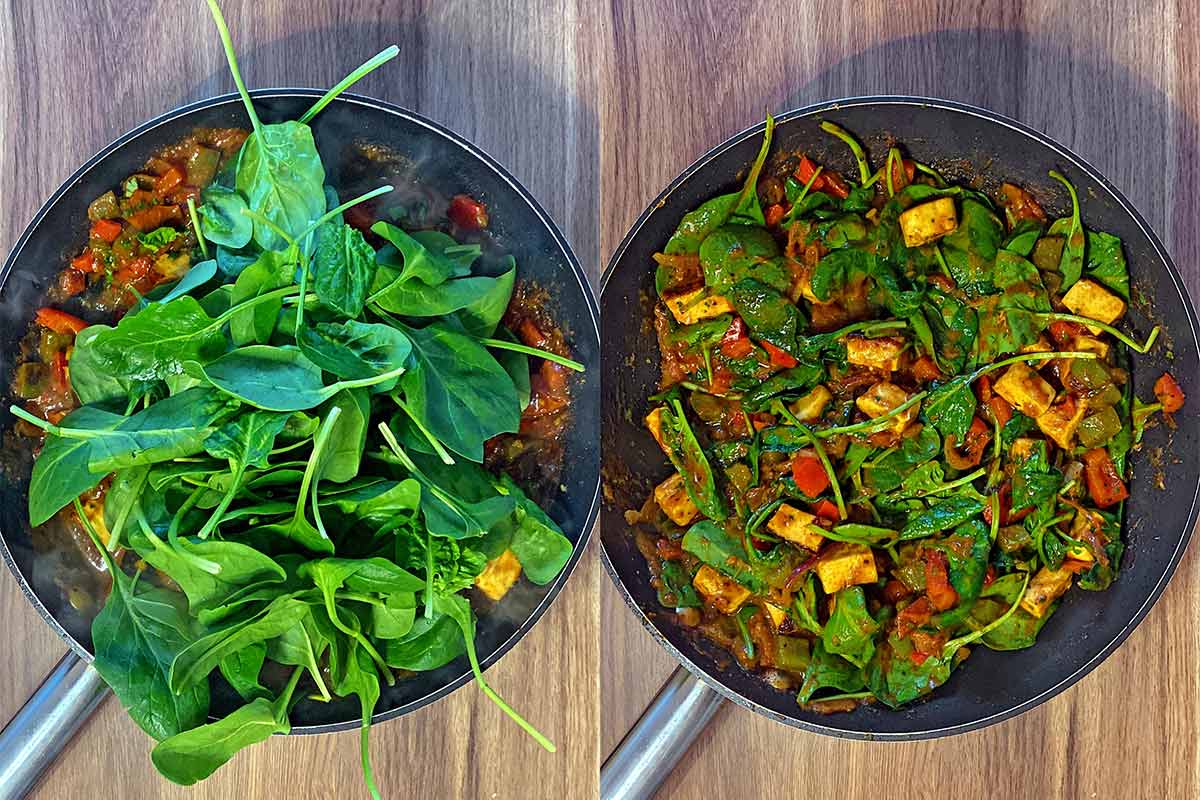 A large pile of spinach leaves added to the pan and then wilted into the curry.
