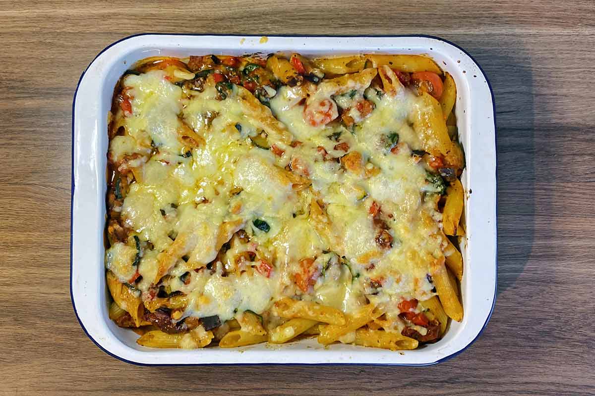 Cooked pasta bake topped with melted cheese.