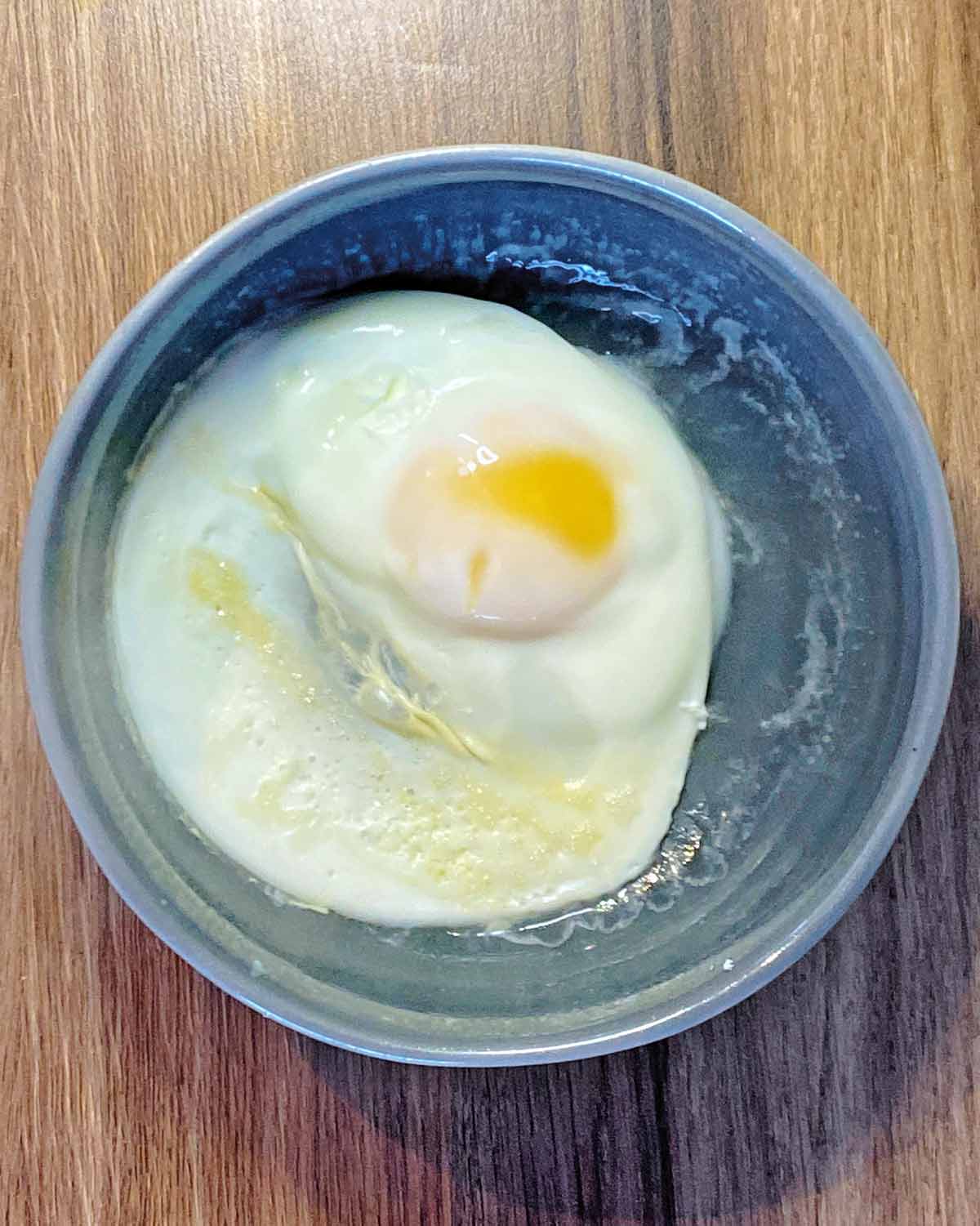 A cook egg in a round bowl.