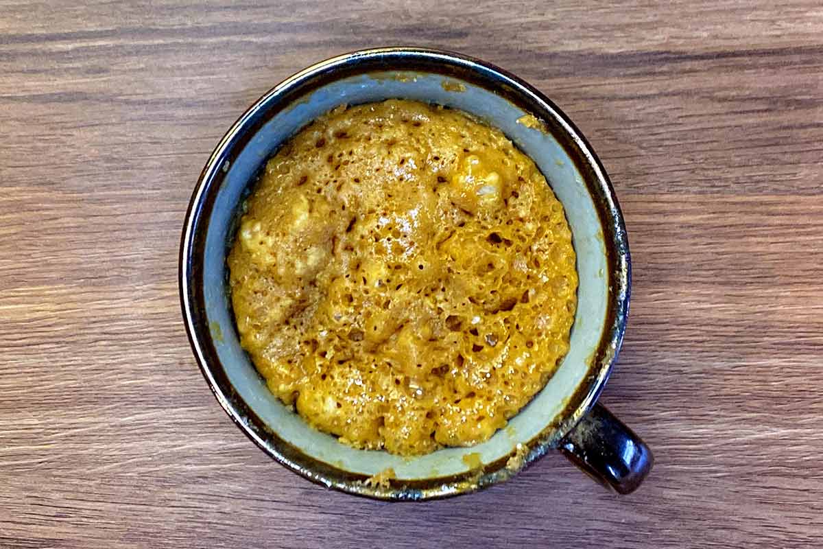 Cooked biscoff cake in a mug.