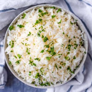 Oven cooked rice in a round bowl.