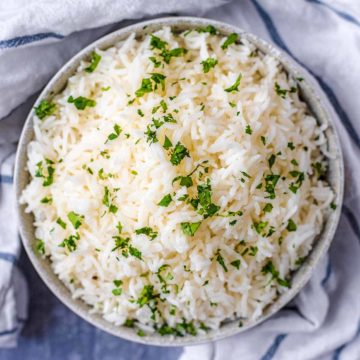 Oven cooked rice in a round bowl.