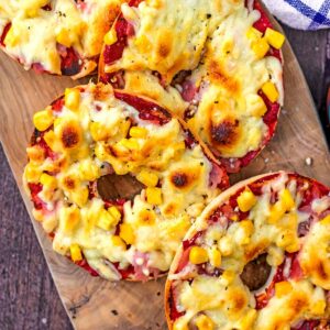 Pizza Bagels on a wooden board.