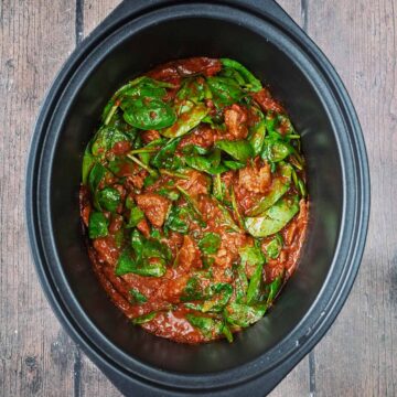 Slow cooker beef curry in a slow cooker pot.