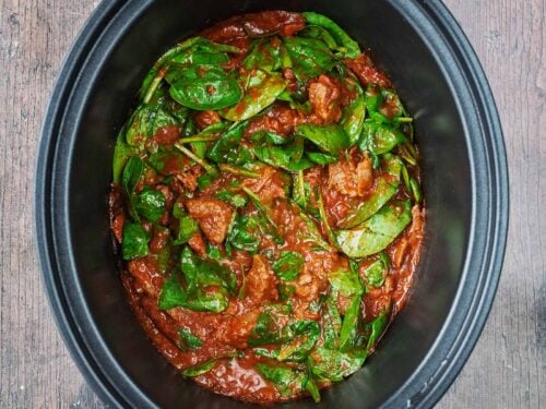 Slow cooker beef curry in a slow cooker pot.