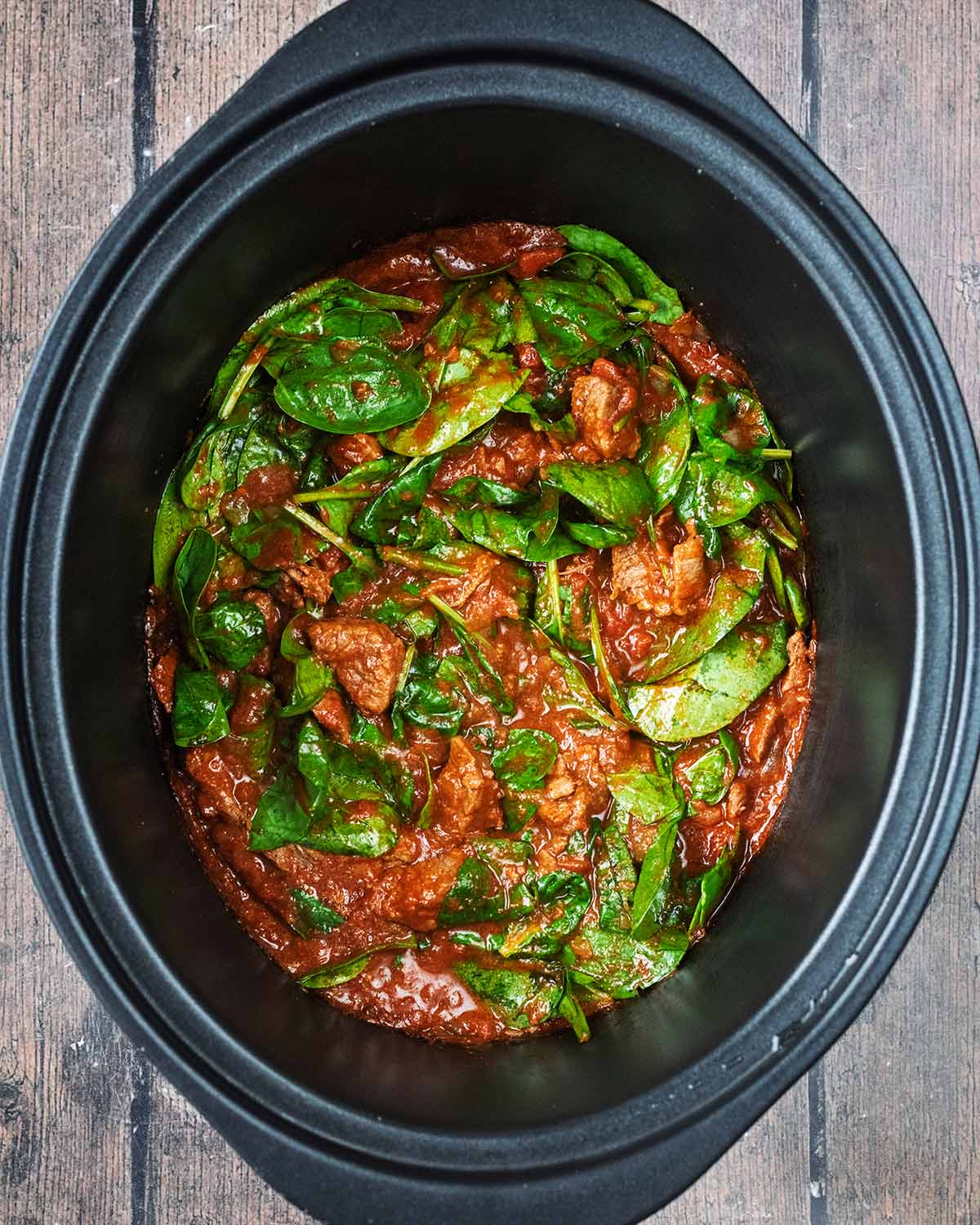 The spinach mixed in and wilted in the curry.