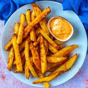 Paprika Chips on a blue plate.