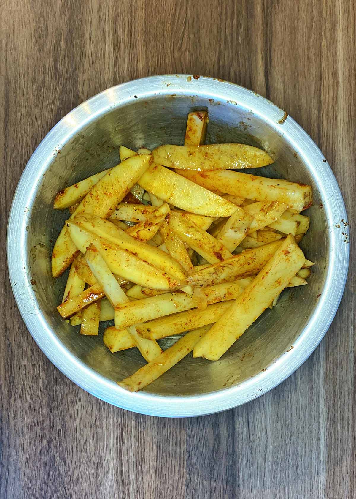 The chips coated in the oil and seasoning.