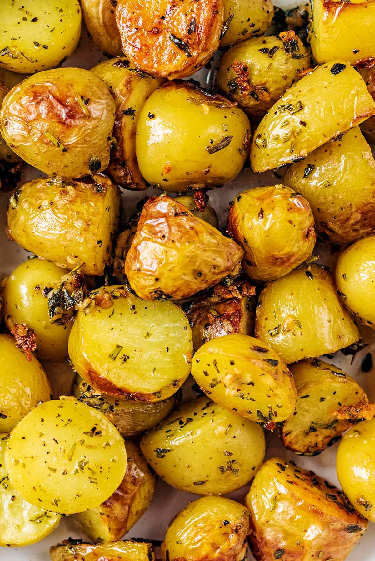 Roasted new potatoes coated in herbs and seasoning.