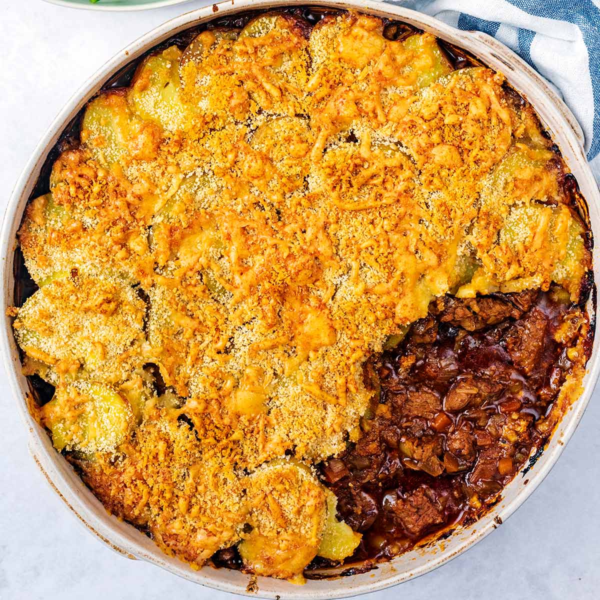 Cumberland pie with a portion removed.