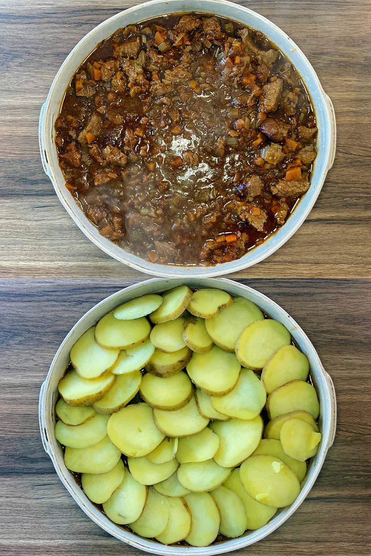 The beef mixture in a large baking dish, then covered in sliced potatoes.