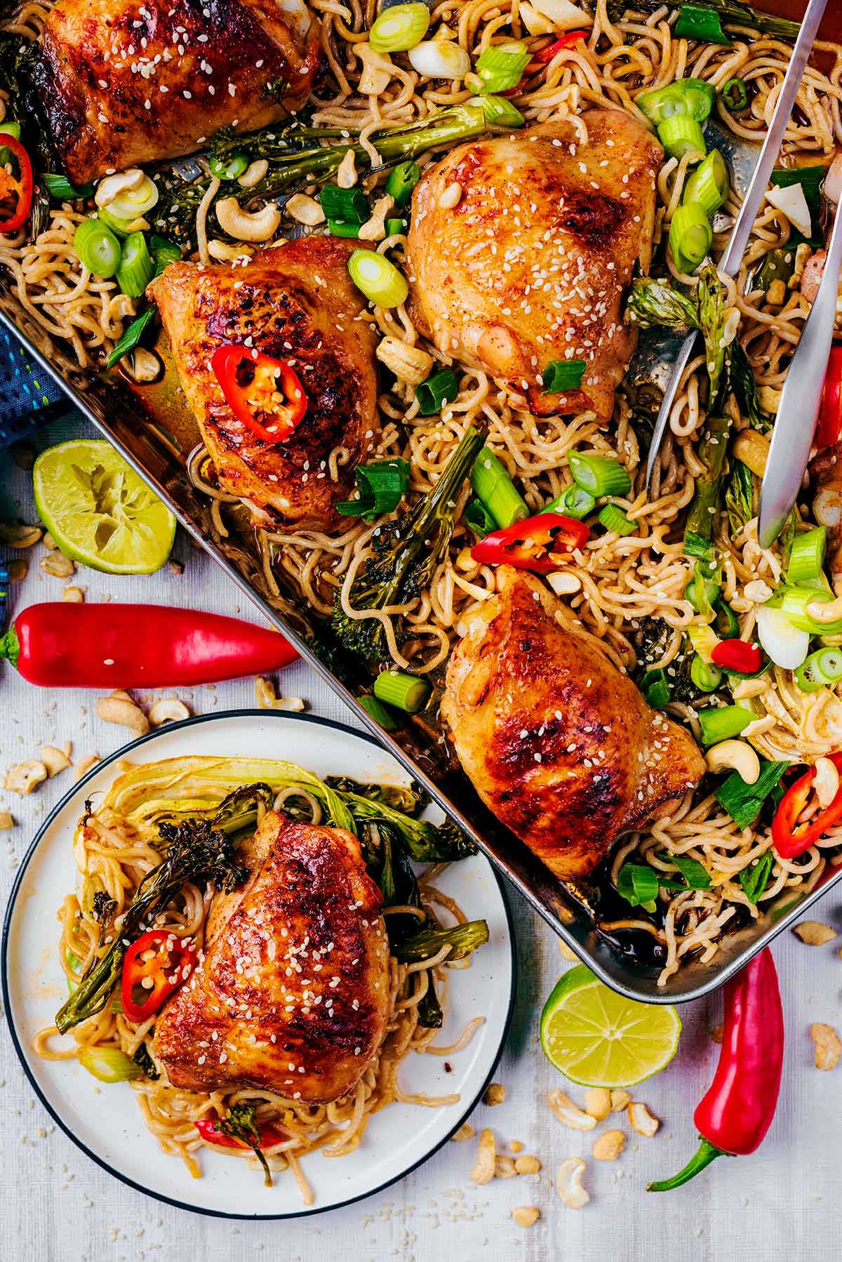 Chicken Tray bake next to a plate of chicken and noodles.