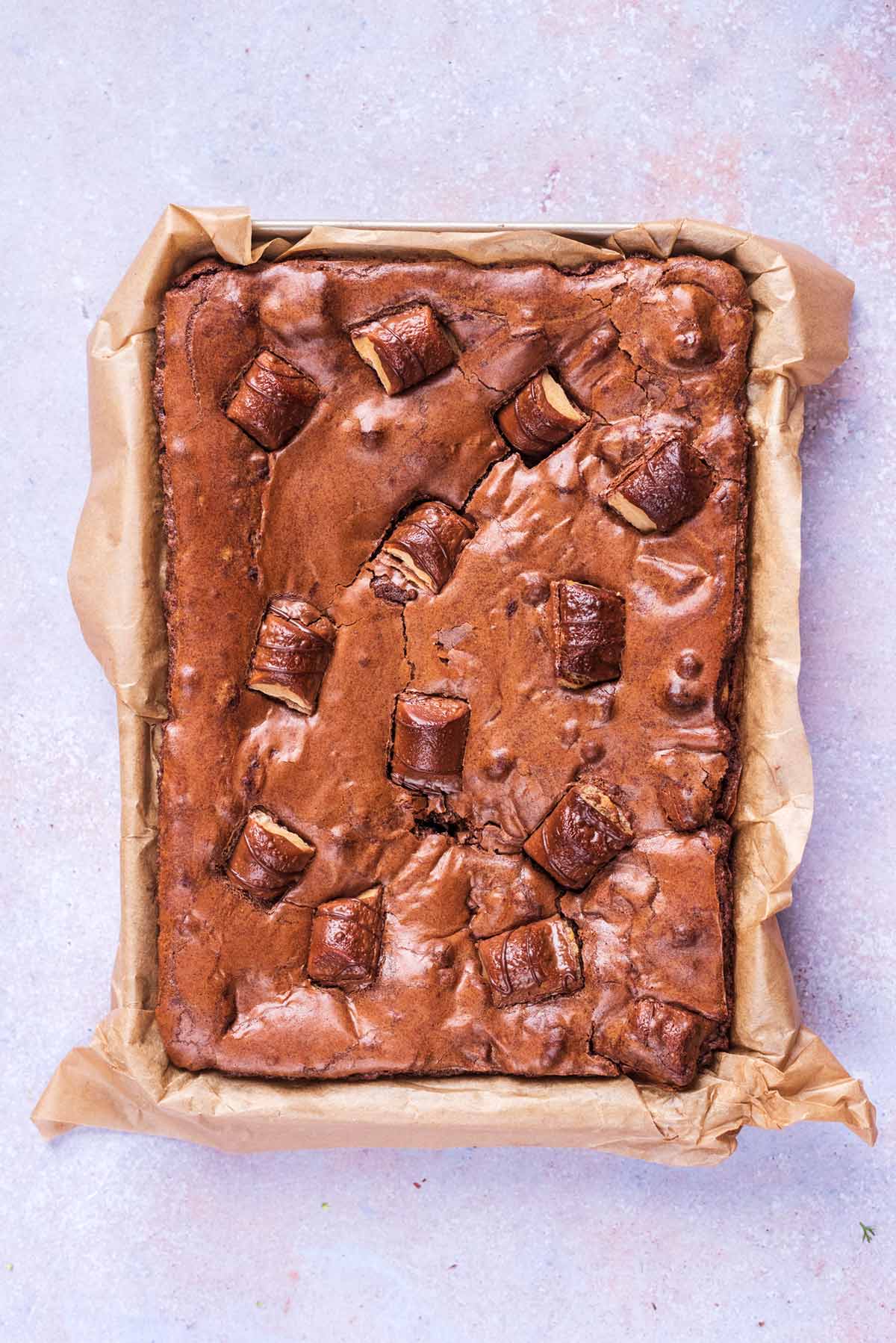A slab of Kinder Bueno brownie in a tray.