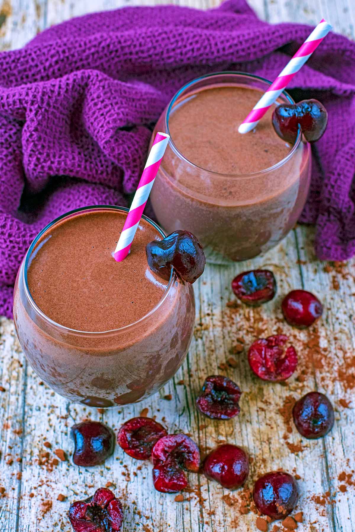 Glasses of Chocolate smoothie with striped straws.