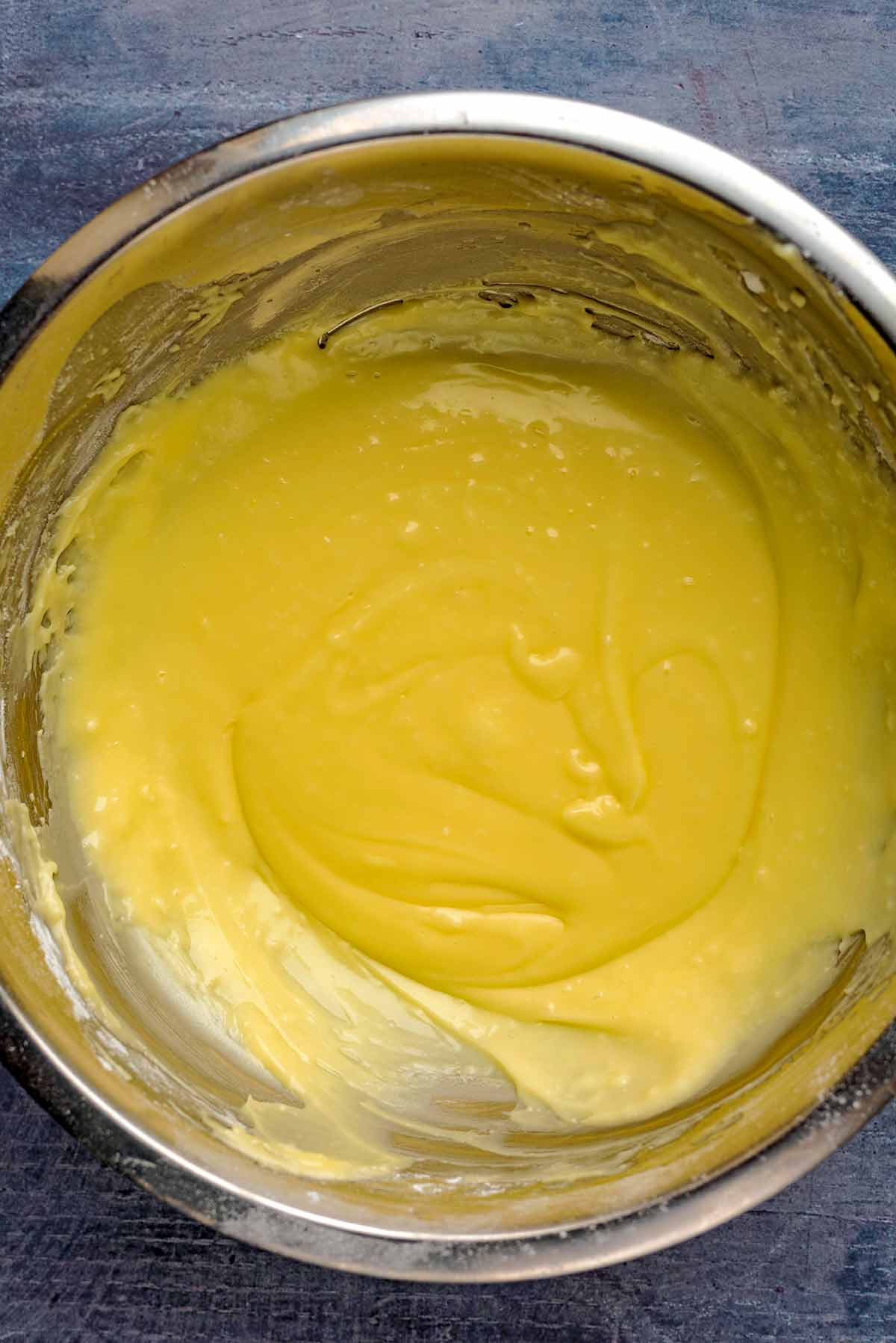 Vanilla frosting in a mixing bowl.