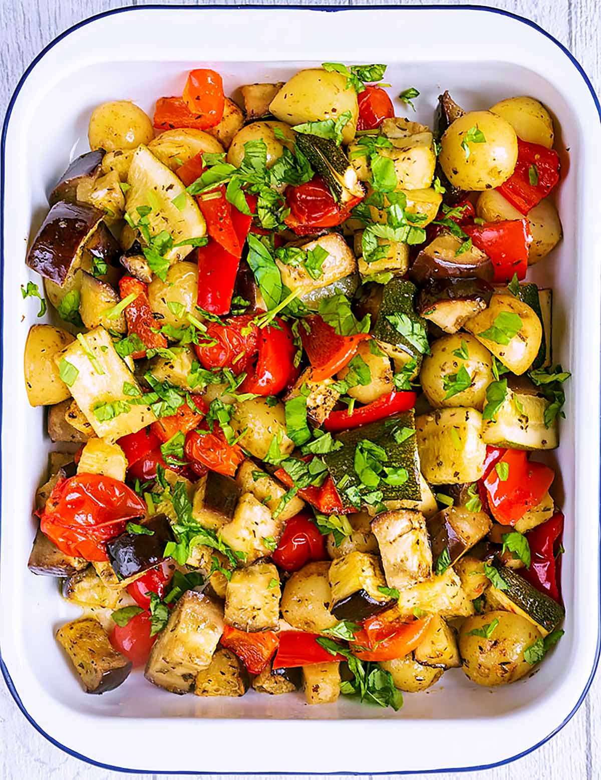 A roasting dish containing roasted vegetables.