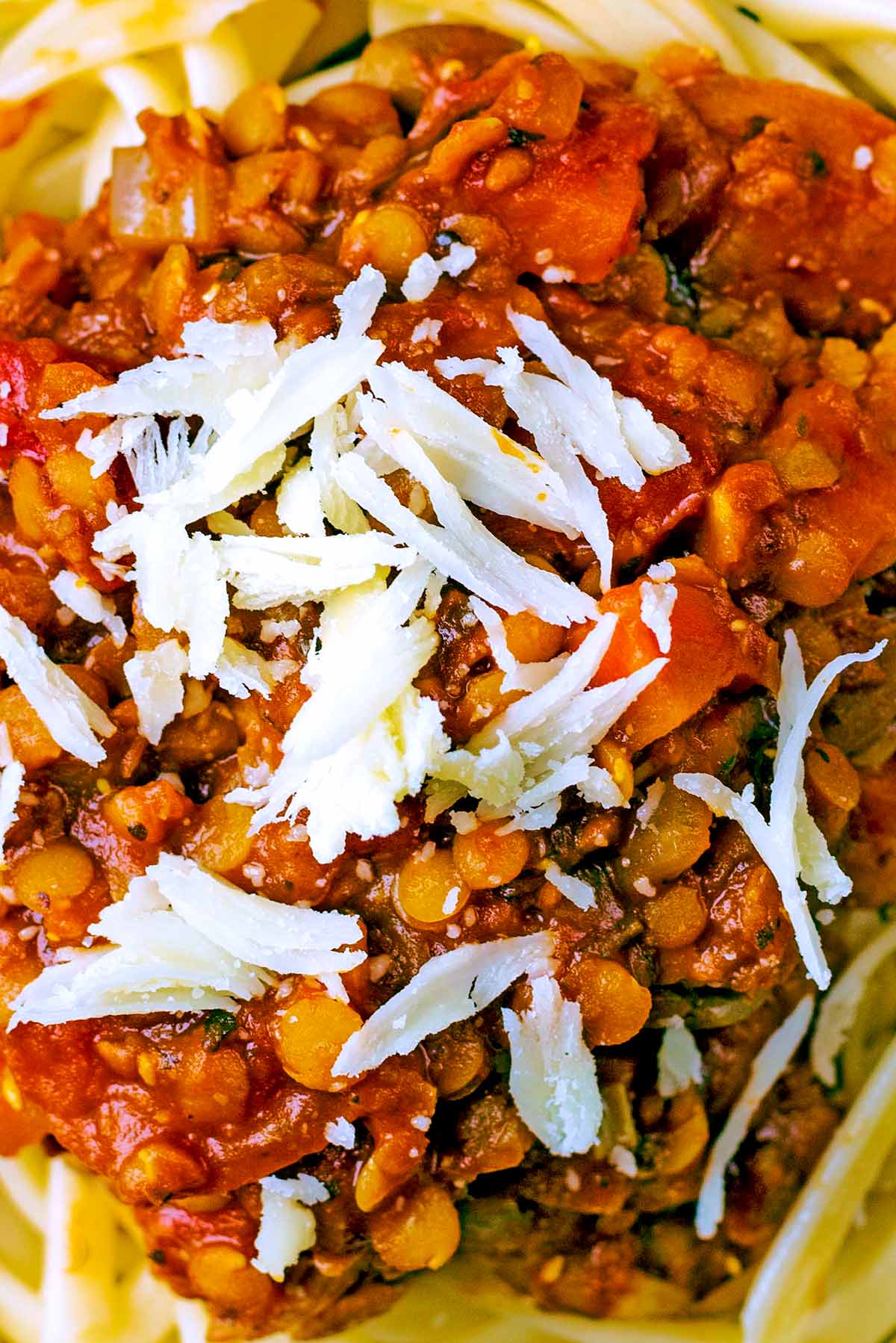 Lentil bolognese with some shavings of cheese.