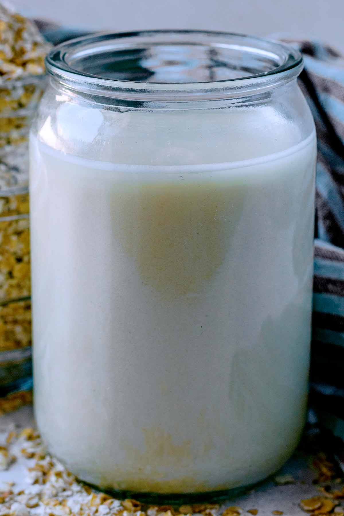A glass full of oat milk.
