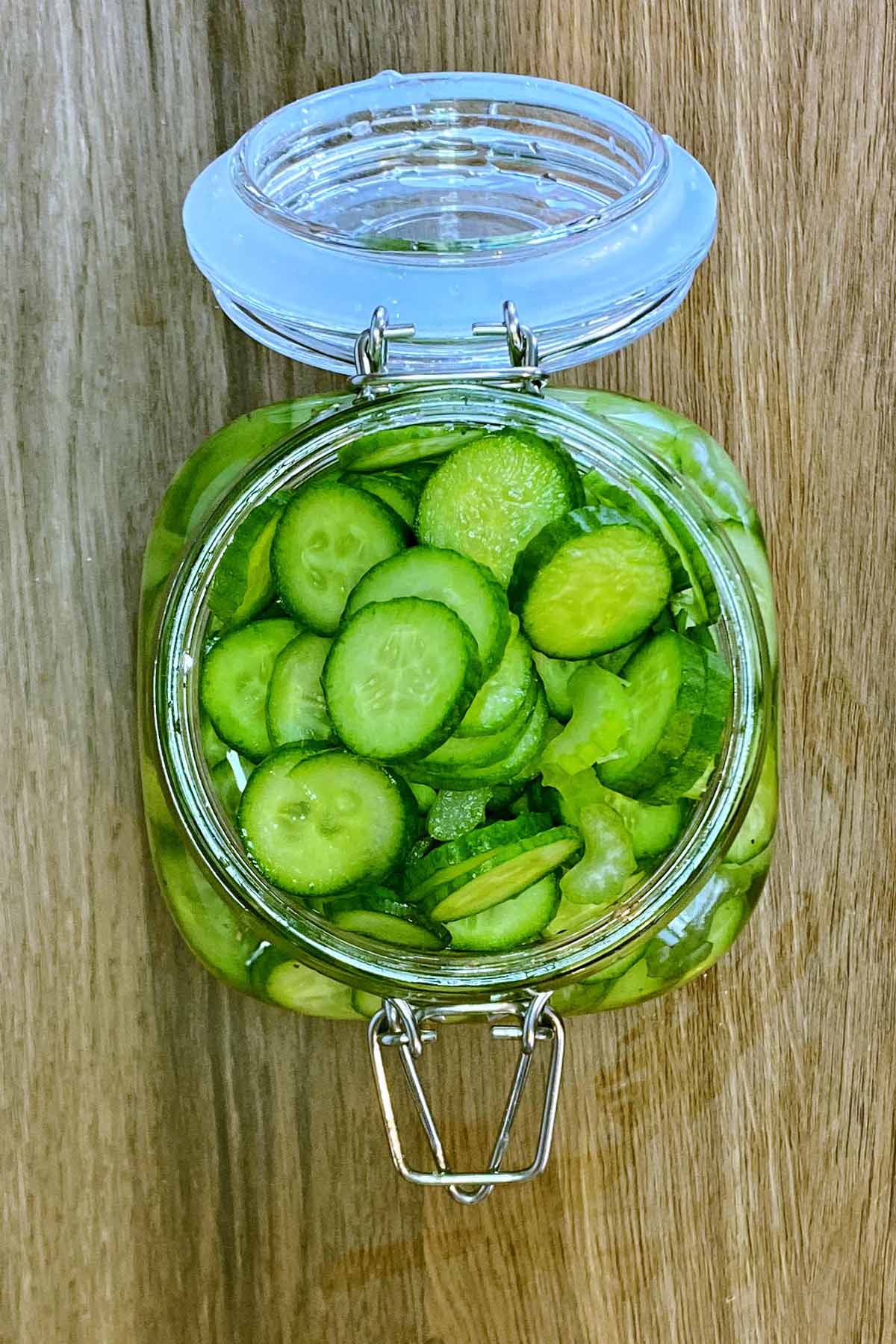 cucumbers and celery slices added to the jar.