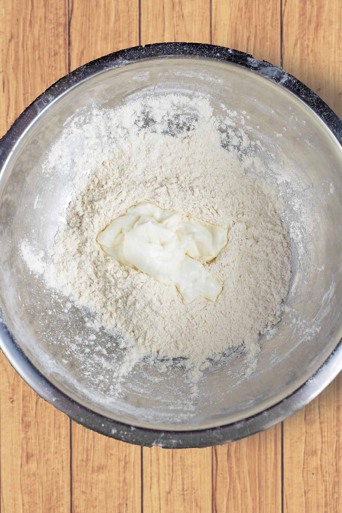 Flour and yogurt in a mixing bowl.