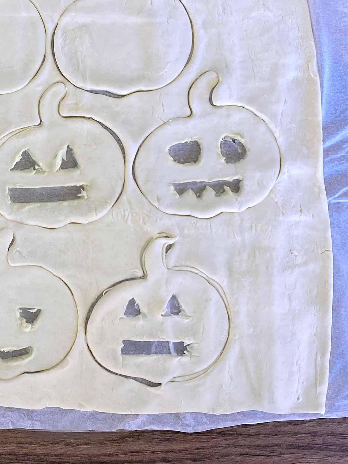 Jack O'Lantern faces cut into the pumpkin shapes.